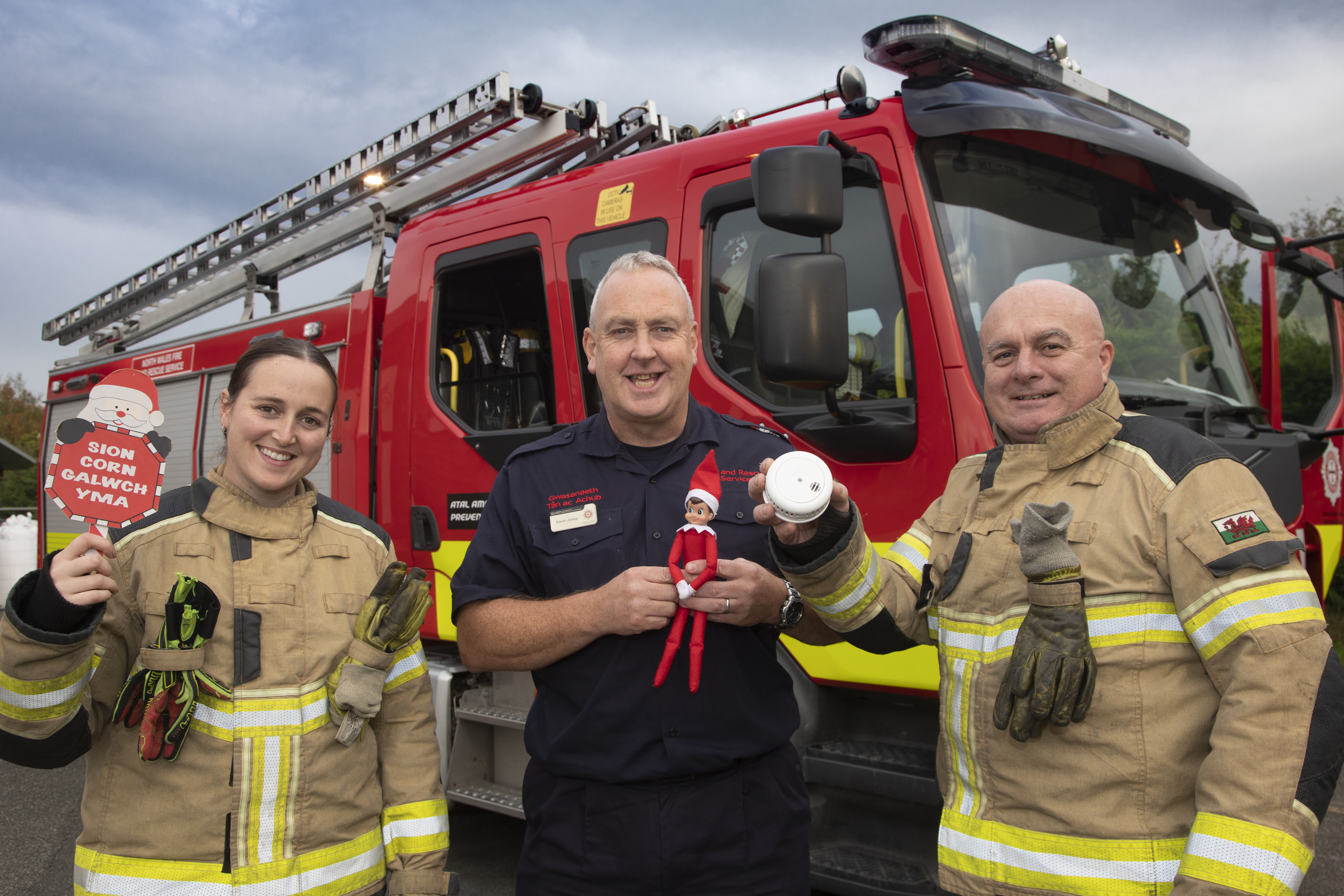 24 10 23 NWFRS Eirias Park 6 Head of Prevention Kevin Jones alongside firefighters with Christmas decorations